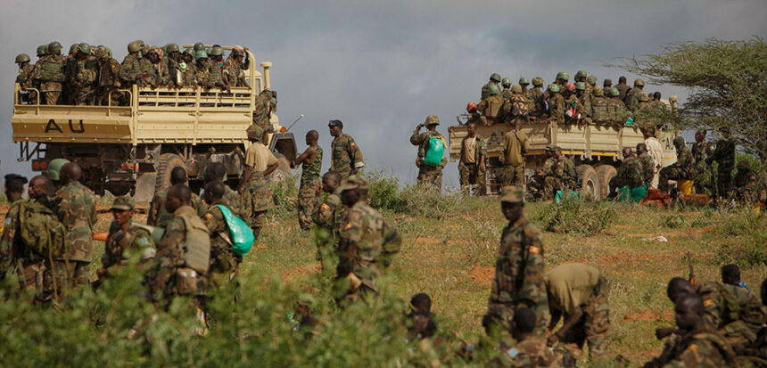 cc AMISOM Public Information, modified, AMISOM Public Information AMISOM & Somali National Army operation to capture Afgoye Corridor Day #5 03 Ugandan soldiers serving with the African Union Mission in Somalia (AMISOM) are seen on the the back of military trucks 25 May 2012 in the town of Afgoye to the west of the Somali capital Mogadishu as they prepare to deploy south of the town on the road to Merka. An joint-AMISOM and Somali National Army (SNA) offensive has driven the Al-Qaeda-affiliated extremist group Al Shabaab from the strategically important area of the Afgoye corridor, which the group used as a base to launch attacks inside Mogadishu and is also home to hundreds of thousands of refugees. With the extremists gone, the area is now secure for humantarian aid to reach the internally displaced peoples camps and opens the road between the agriculturally productive area of Afgoye and the Somali capital, allowing freedom of movement of goods, produce and people alike. AU-UN IST PHOTO / STUART PRICE.